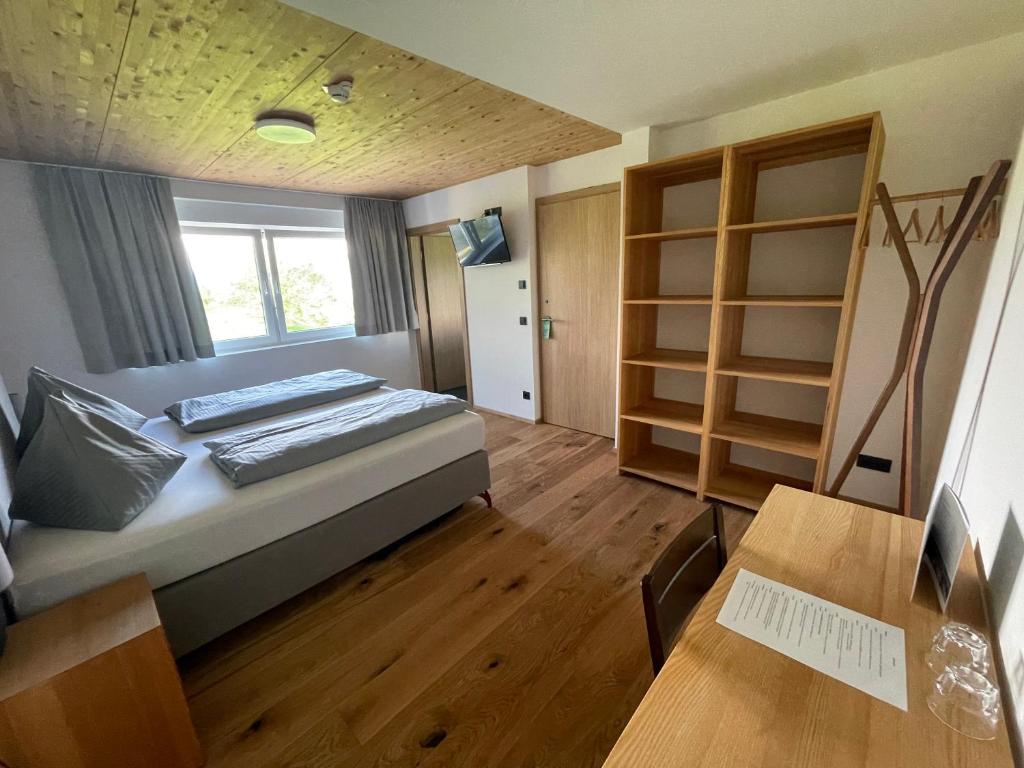 Postel nebo postele na pokoji v ubytování Panoramahotel Sonnhalde
