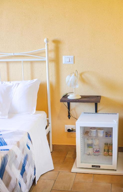 Łóżko lub łóżka w pokoju w obiekcie Agriturismo Poggio Degli Ulivi