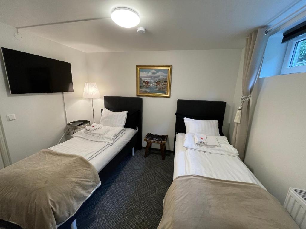 Postel nebo postele na pokoji v ubytování Vid Gekås Ullared Boende B&B