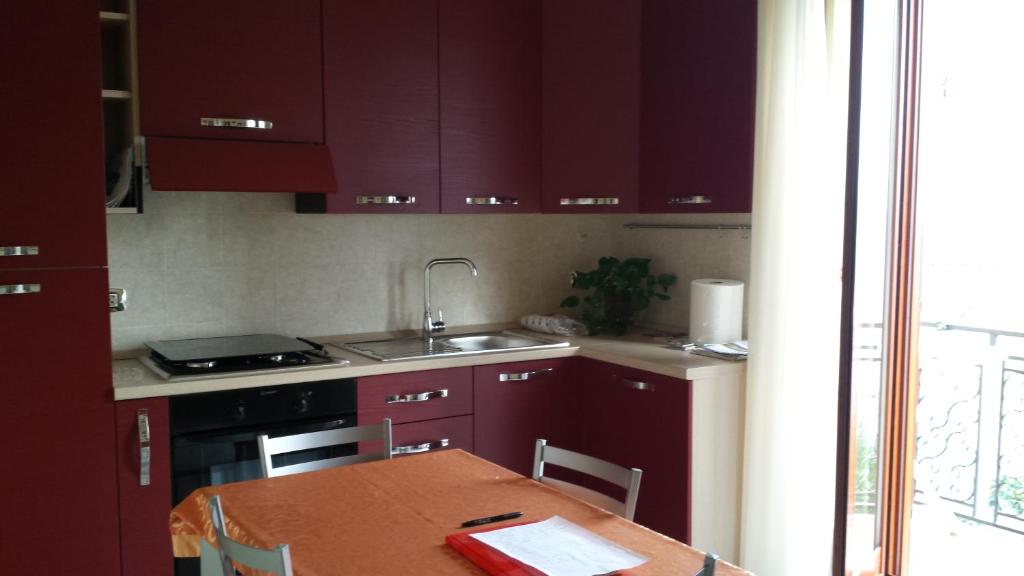Kuchyň nebo kuchyňský kout v ubytování B&B Lo Sparviero