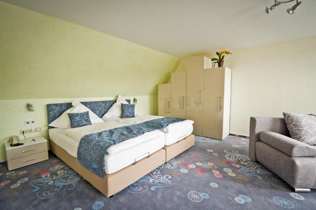 Postel nebo postele na pokoji v ubytování Hotel Waldrausch
