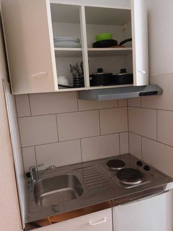 Kuchyň nebo kuchyňský kout v ubytování Business Apartment Reutlingen