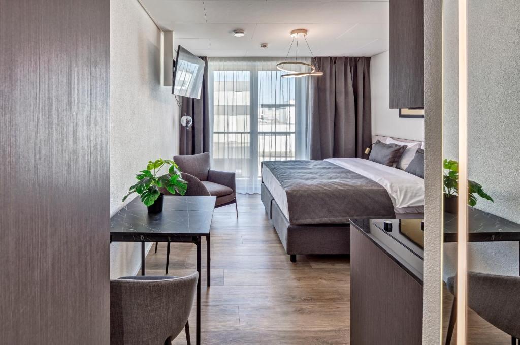 Postel nebo postele na pokoji v ubytování MOOI Apartments Schlieren
