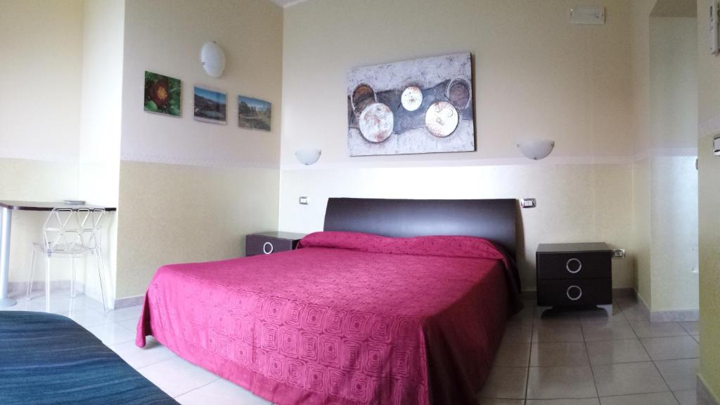 Postel nebo postele na pokoji v ubytování B&B Lo Sparviero