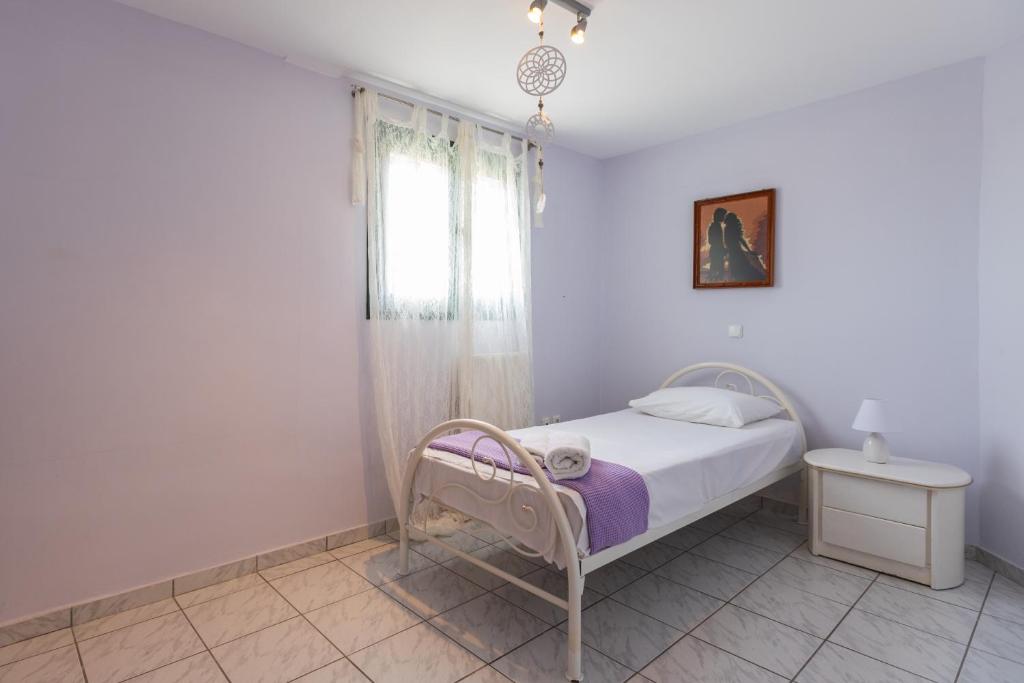 Postel nebo postele na pokoji v ubytování A&S Seaside Maisonette