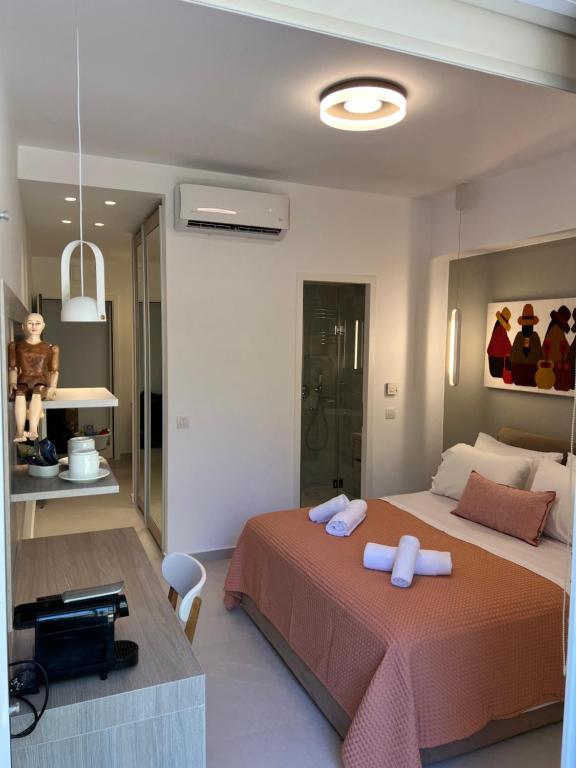 Postel nebo postele na pokoji v ubytování Fospitality Varkiza