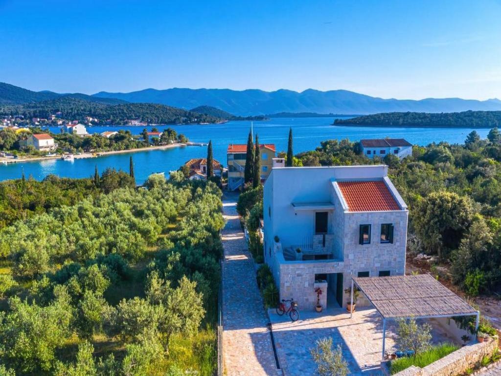 an aerial view of a house next to the water at Villa Vera in Lovište