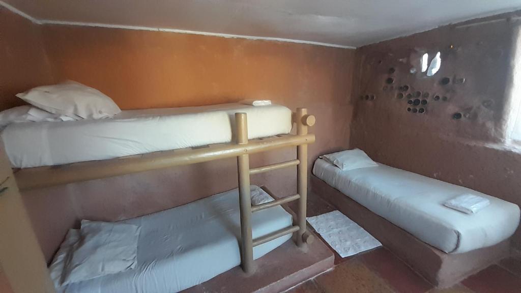 Voodi või voodid majutusasutuse Aji Verde Hostel San Pedro toas
