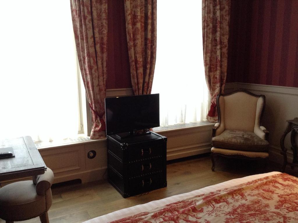 TV a/nebo společenská místnost v ubytování Hotel Patritius