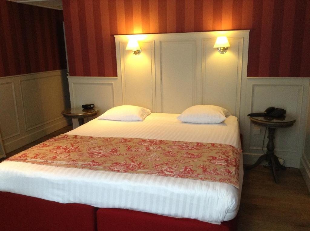 Postel nebo postele na pokoji v ubytování Hotel Patritius
