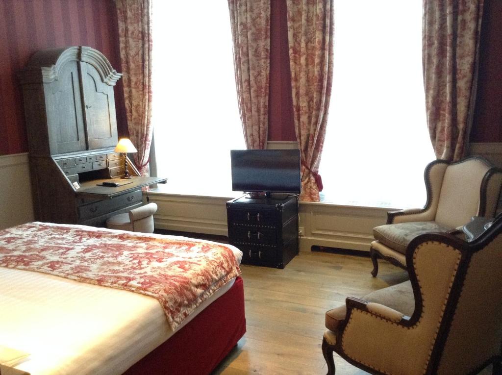 Postel nebo postele na pokoji v ubytování Hotel Patritius