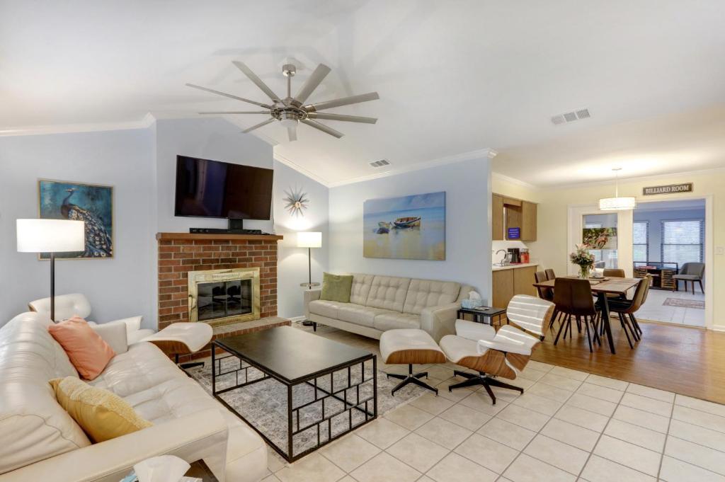 a living room with a couch and a fireplace at Pooler Travelers Retreat I - Entire House - in Savannah