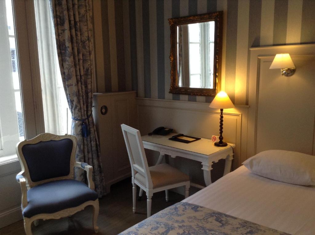 Postel nebo postele na pokoji v ubytování Hotel Patritius