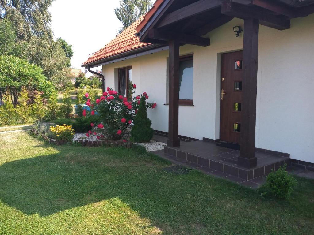 Vonkajšia záhrada v ubytovaní Dom Mazurska Apartamenty