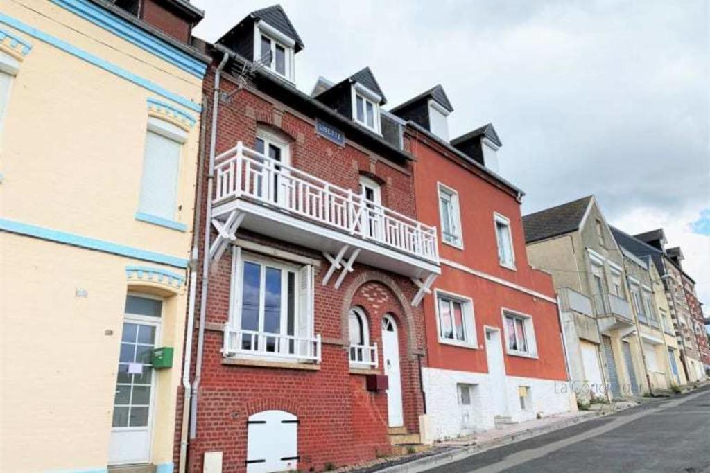 a red brick building on the side of a street at AL 11 - Villa "La Lisette" 8 personnes in Ault