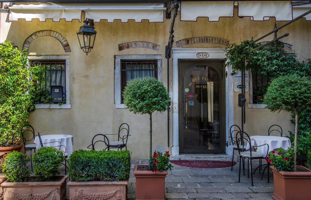 a restaurant with tables and chairs in front of a building at Ai Due Fanali Adults Only in Venice