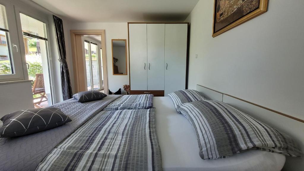 Postel nebo postele na pokoji v ubytování Apartma Julija