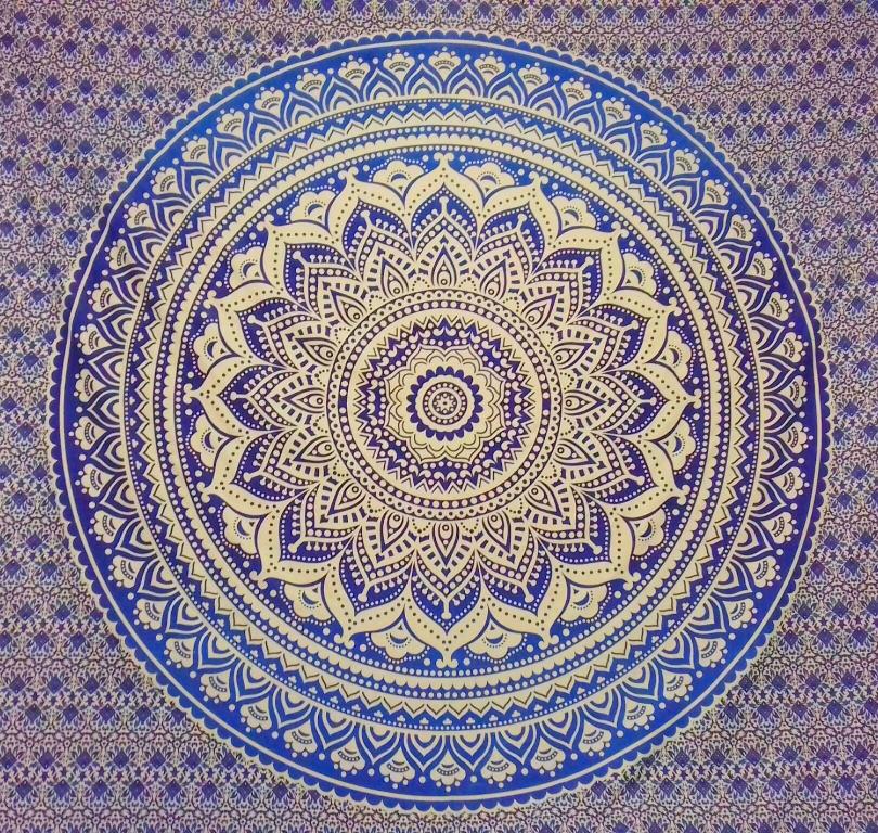 a blue and white plate with a mandala on it at Balatoni Mandala Vendégház in Balatonszemes