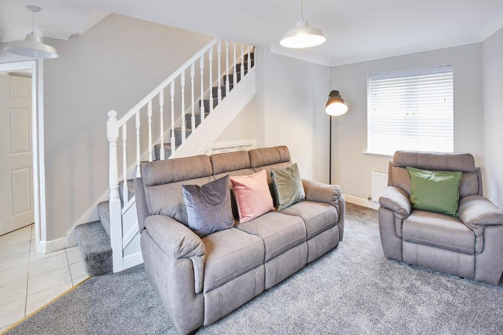 a living room with a couch and two chairs at Host & Stay - Aynsley Mews in Consett