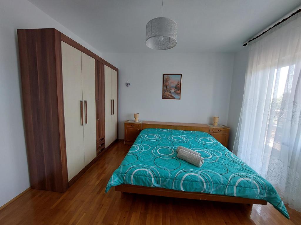 Łóżko lub łóżka w pokoju w obiekcie Apartments Rusin