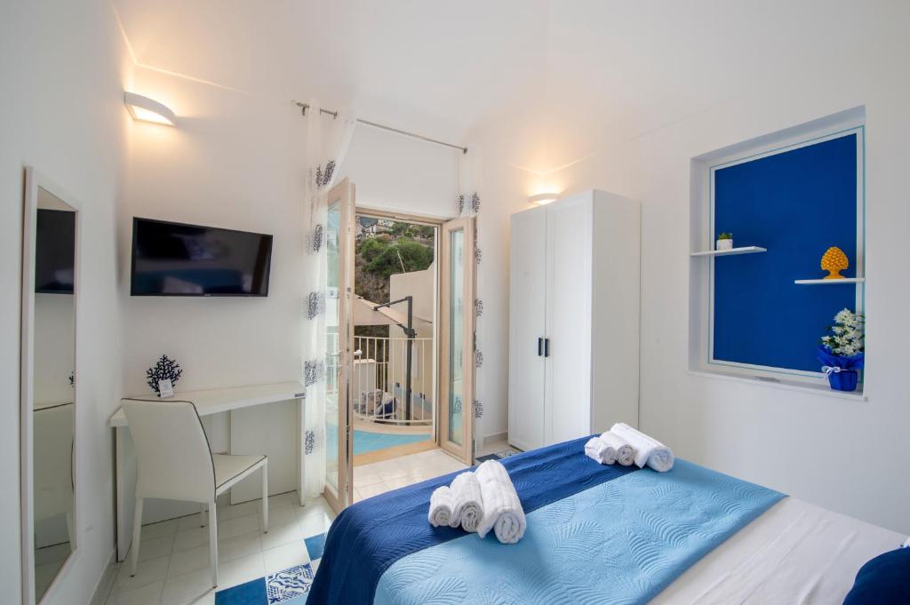 Кровать или кровати в номере Residence Buonocore