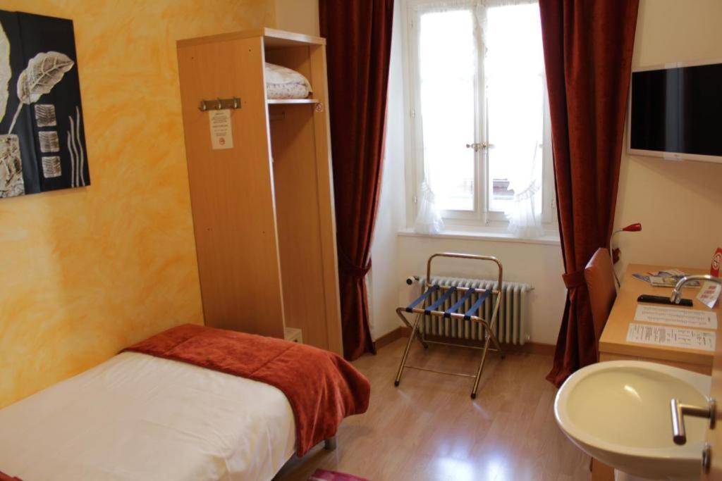 Letto o letti in una camera di Hostellerie du XVI Siècle