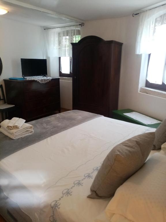 Postel nebo postele na pokoji v ubytování Rooms Serafin