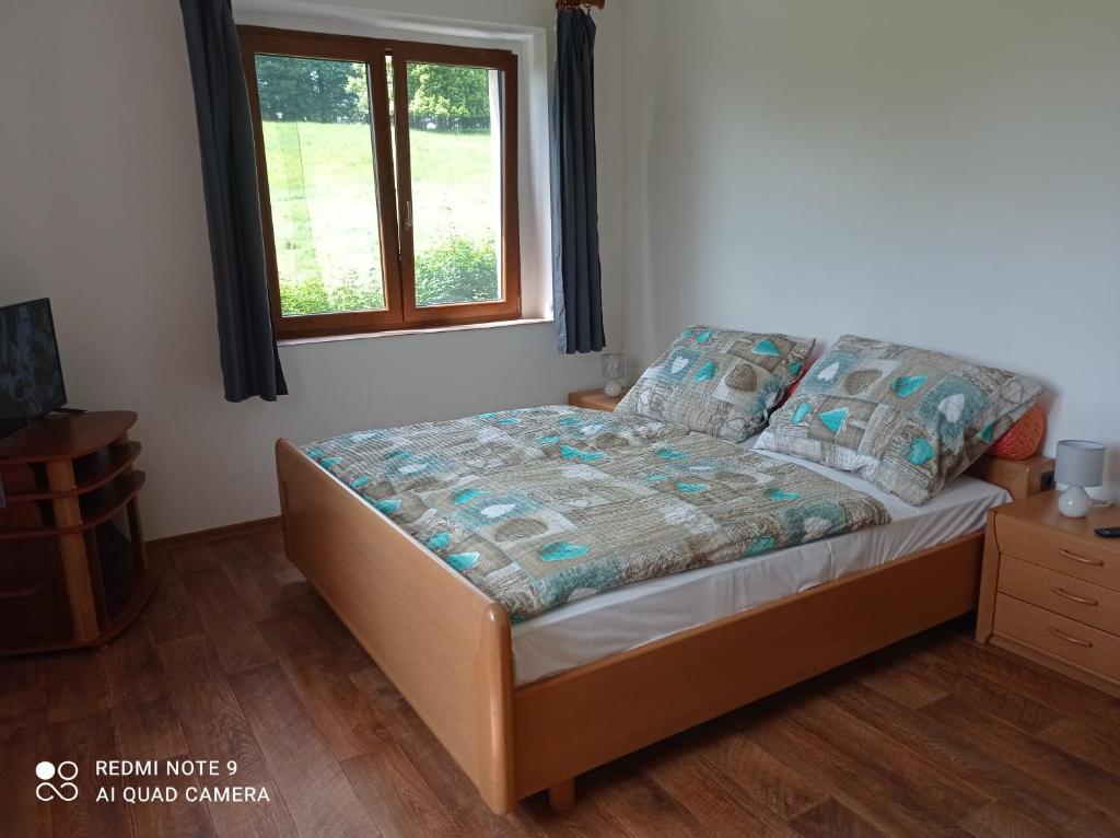 Postel nebo postele na pokoji v ubytování Apartmány u Bečova nad Teplou