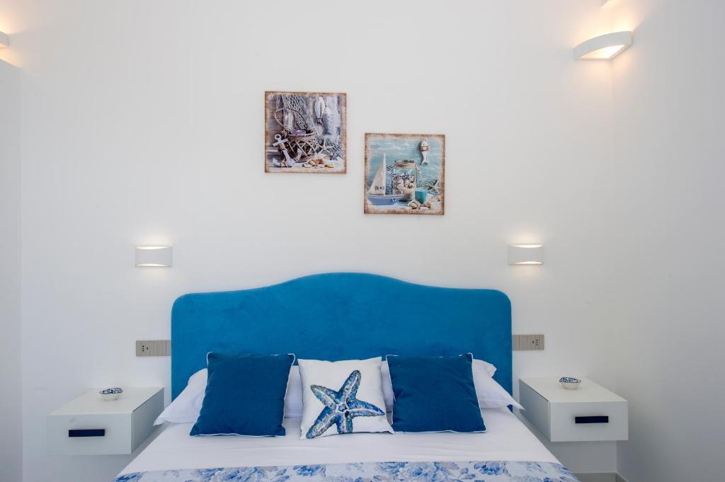 Кровать или кровати в номере Residence Buonocore