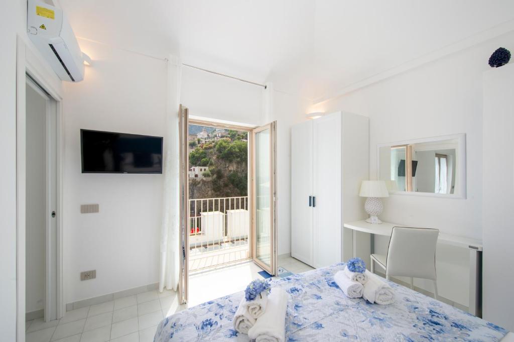 Кровать или кровати в номере Residence Buonocore