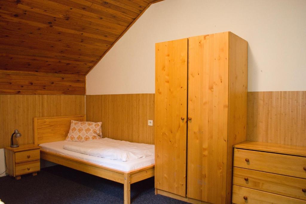 Postel nebo postele na pokoji v ubytování Churáňov Stadion