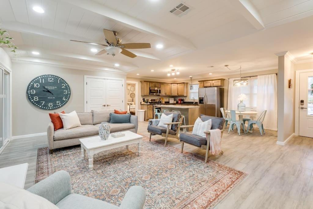 a living room with a clock on the wall at 3 BR Newly Remodeled Home With Farm Style Decor in Oklahoma City