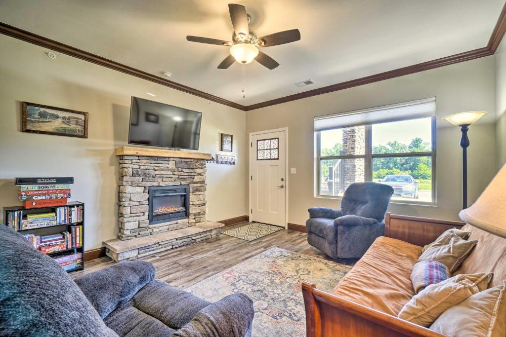 a living room with a couch and a fireplace at Cozy Townsend Condo, Resort-Style Amenities! in Townsend