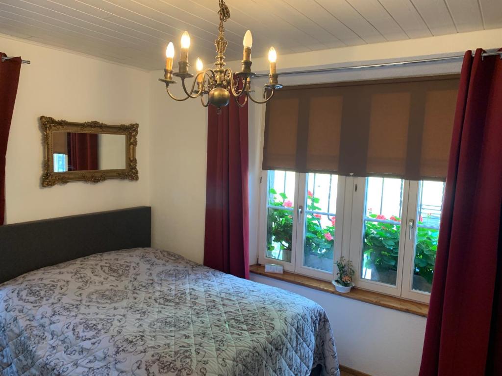 Postel nebo postele na pokoji v ubytování Casa Restelli EG - nahe Andermatt Gotthard