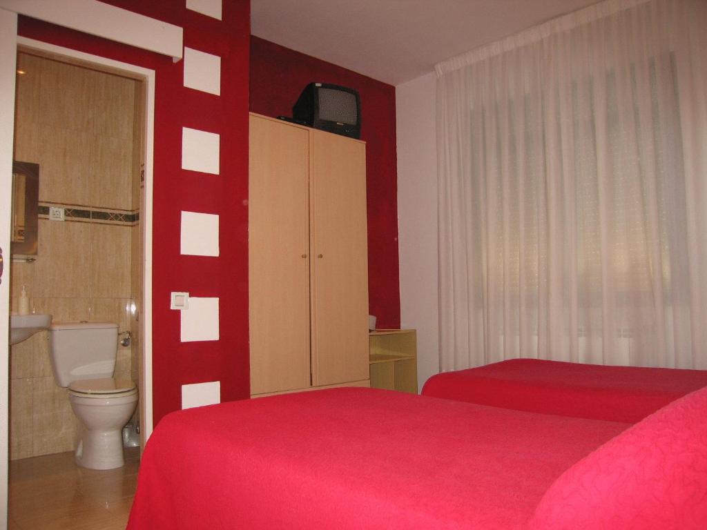 Postel nebo postele na pokoji v ubytování Hospedaje Luciano