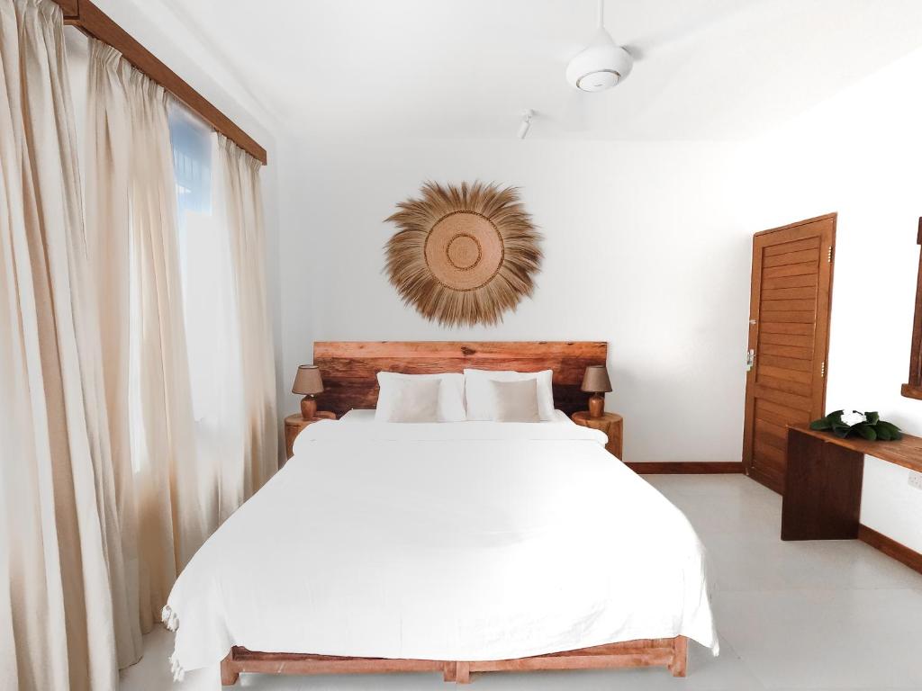 Postel nebo postele na pokoji v ubytování Coco Rise Villas - by Hostly
