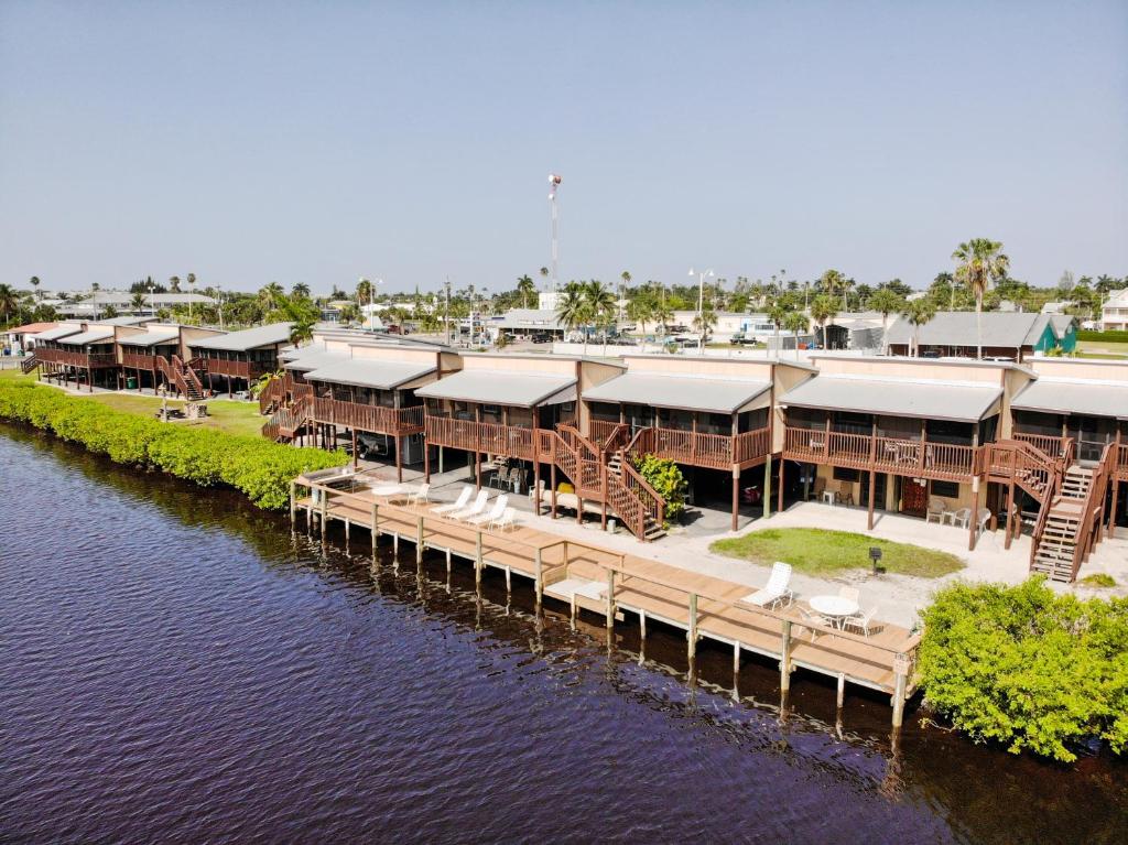 a large body of water with buildings at River Wilderness Waterfront Cabins in Everglades City