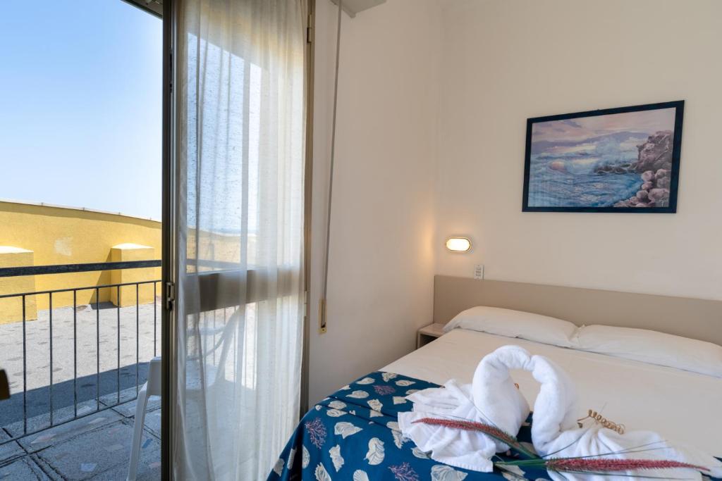 Postel nebo postele na pokoji v ubytování Hotel Montmartre