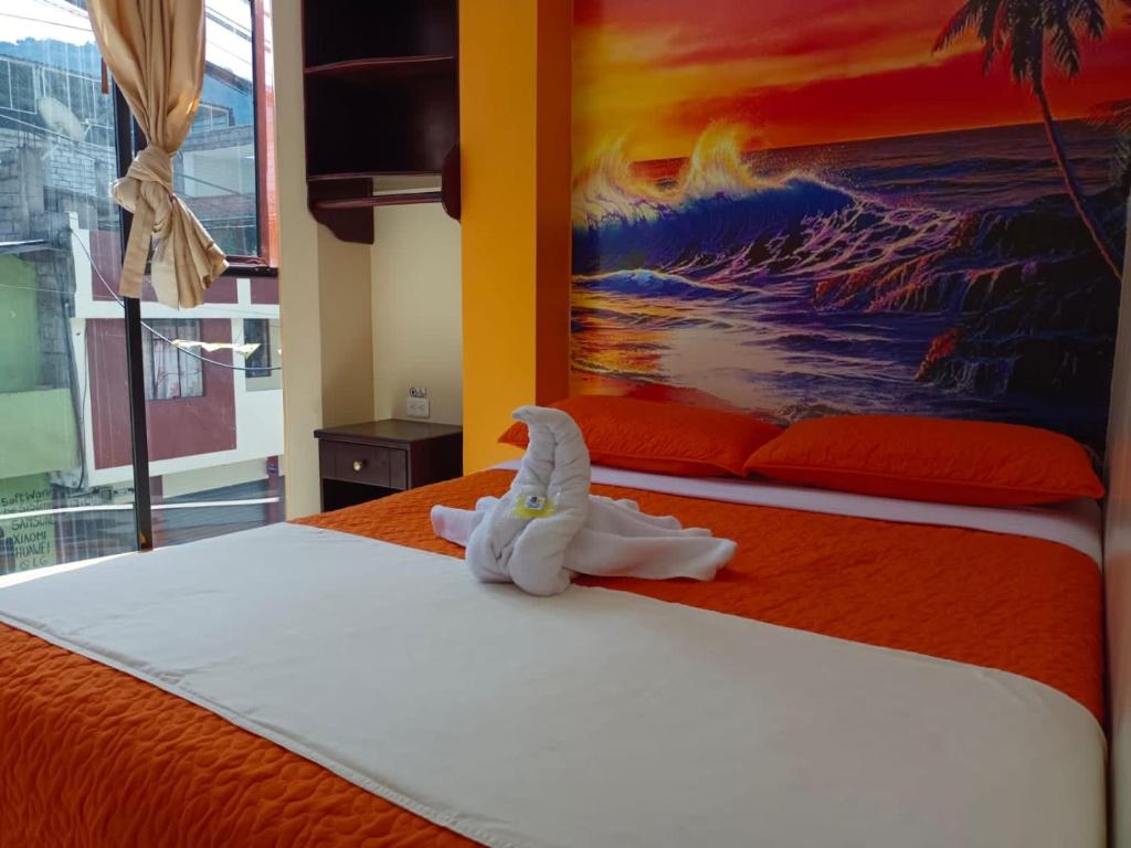 Postel nebo postele na pokoji v ubytování Hostal Bryana Inn Baños