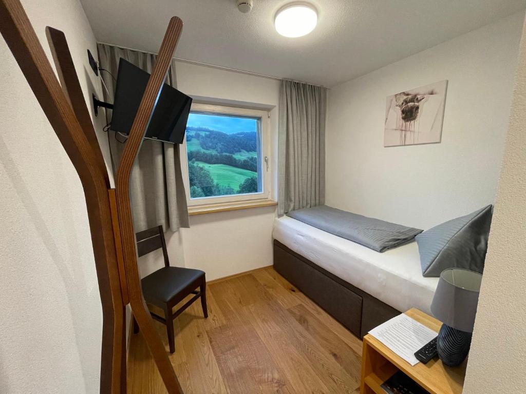 Postel nebo postele na pokoji v ubytování Panoramahotel Sonnhalde