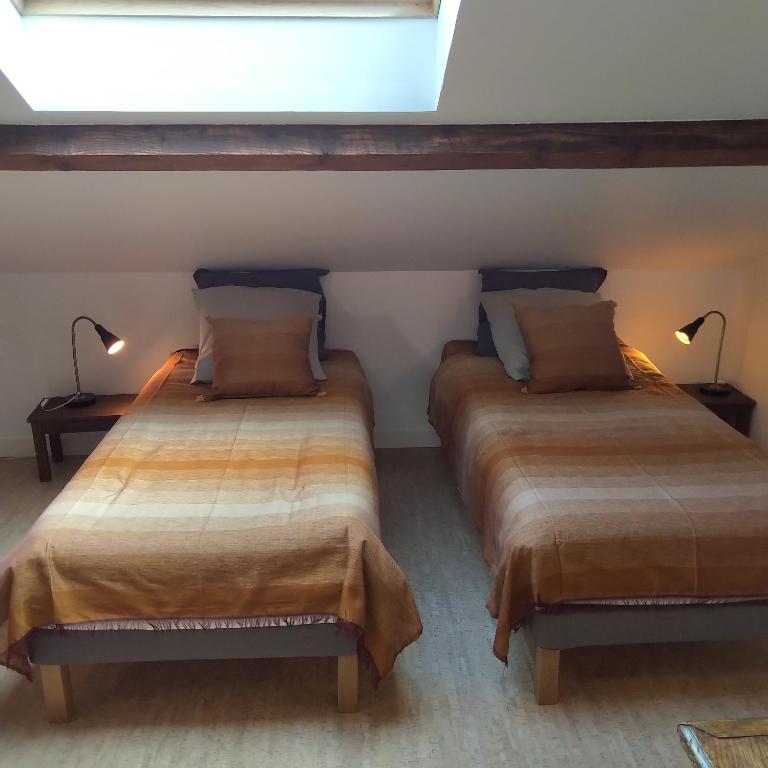 Postel nebo postele na pokoji v ubytování Espace Beléverte Bussière 2 Albizia appartement meublé de 2 chambres