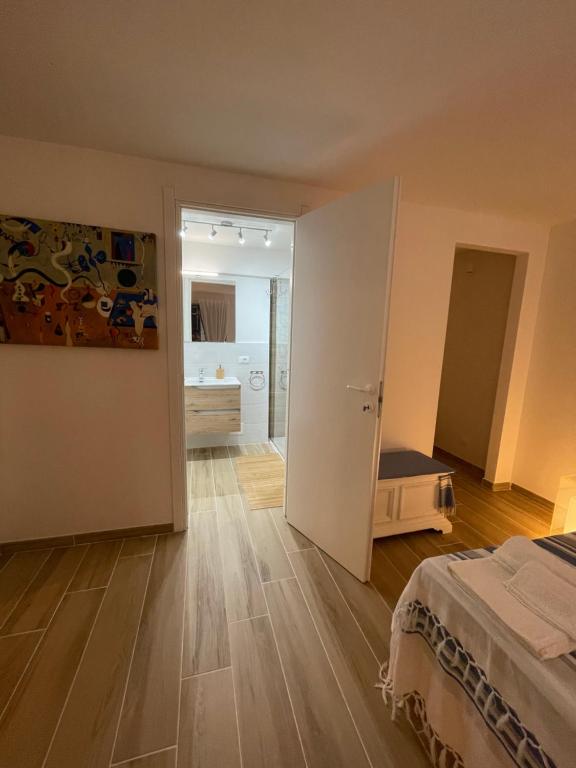 A bed or beds in a room at Surfinia’s home