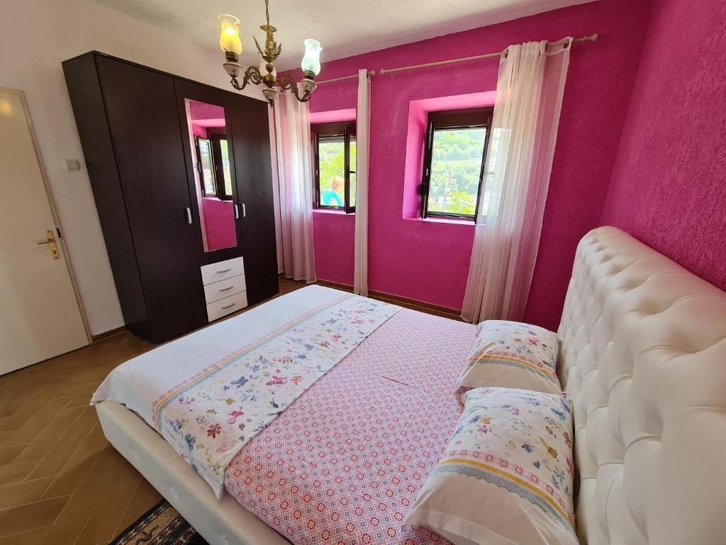 Postel nebo postele na pokoji v ubytování Apartment Dragone