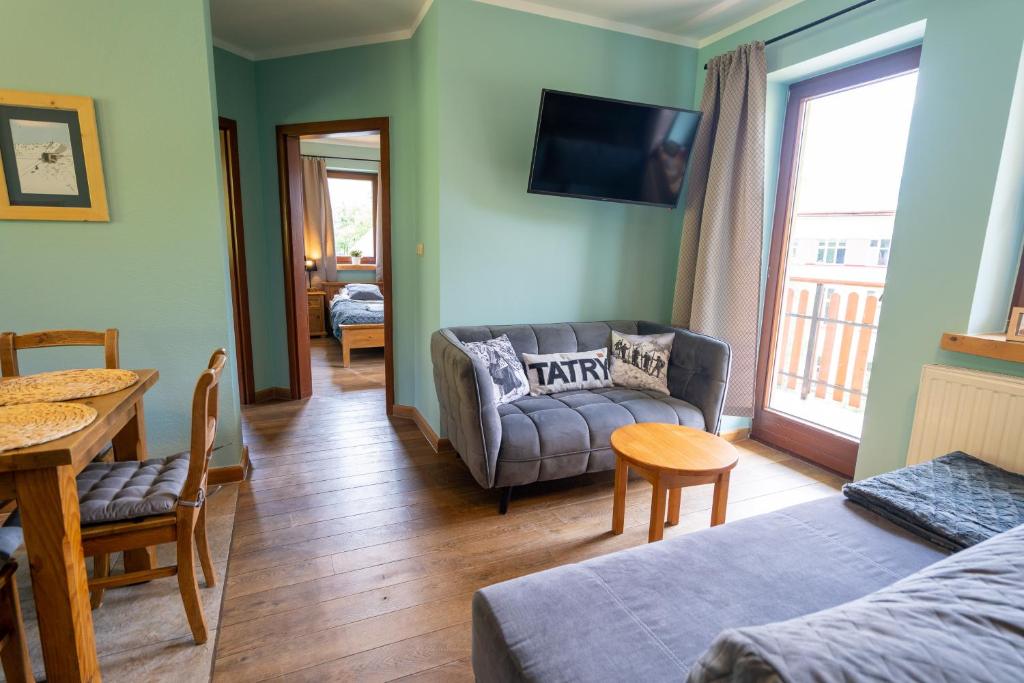 Posteľ alebo postele v izbe v ubytovaní Apartamenty Góralmobile Zakopane
