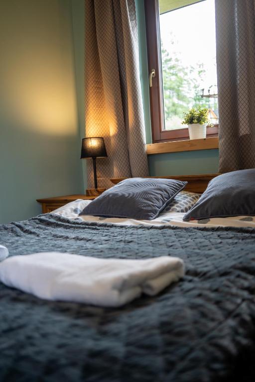Posteľ alebo postele v izbe v ubytovaní Apartamenty Góralmobile Zakopane