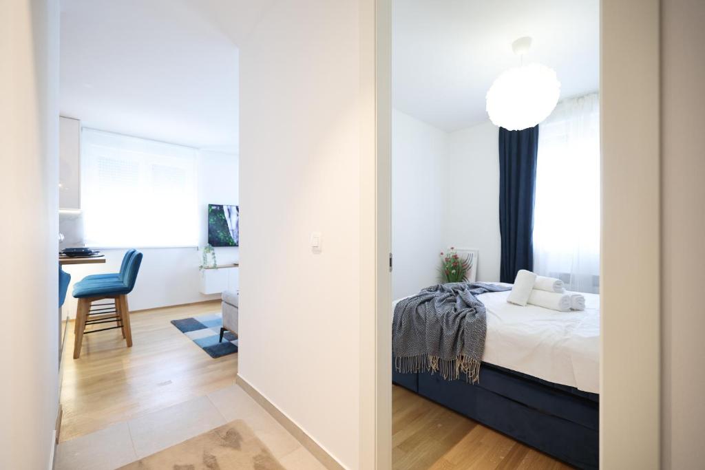 Posteľ alebo postele v izbe v ubytovaní Apartment AnViNi