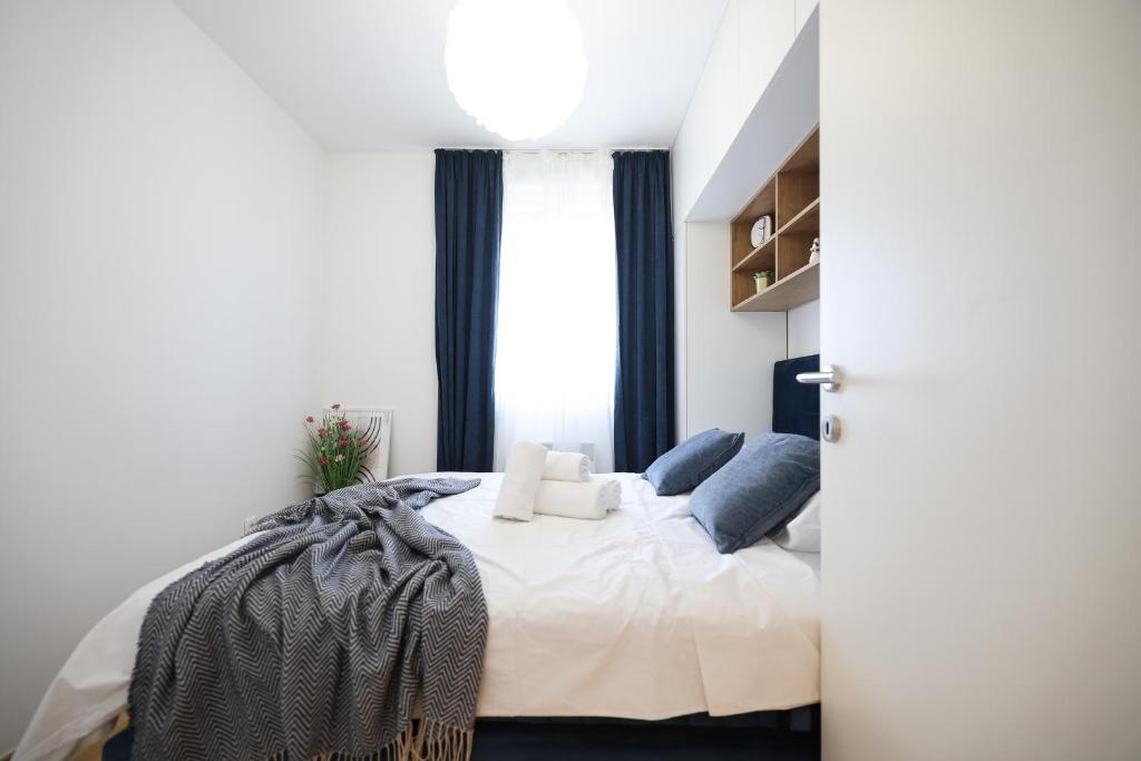 Posteľ alebo postele v izbe v ubytovaní Apartment AnViNi