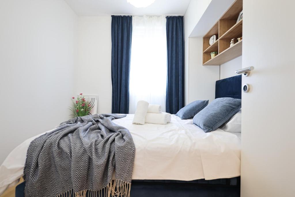 Posteľ alebo postele v izbe v ubytovaní Apartment AnViNi