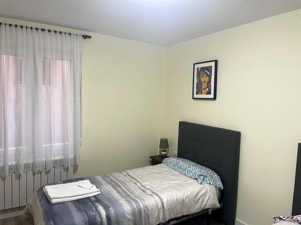 Posteľ alebo postele v izbe v ubytovaní Apartamento Turístico Ávila VUT