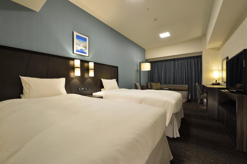 Postel nebo postele na pokoji v ubytování The Royal Park Hotel Tokyo Haneda Airport Terminal 3